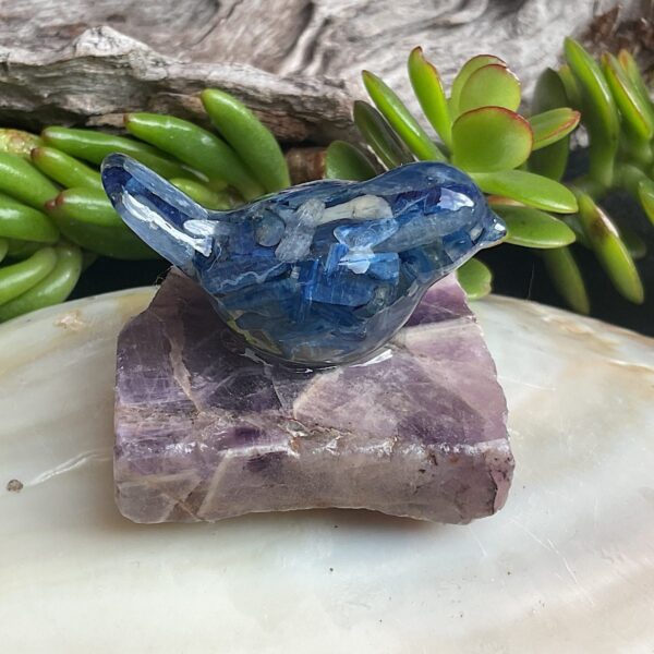 Blue kyanite bird made from resin on chevron amethyst base