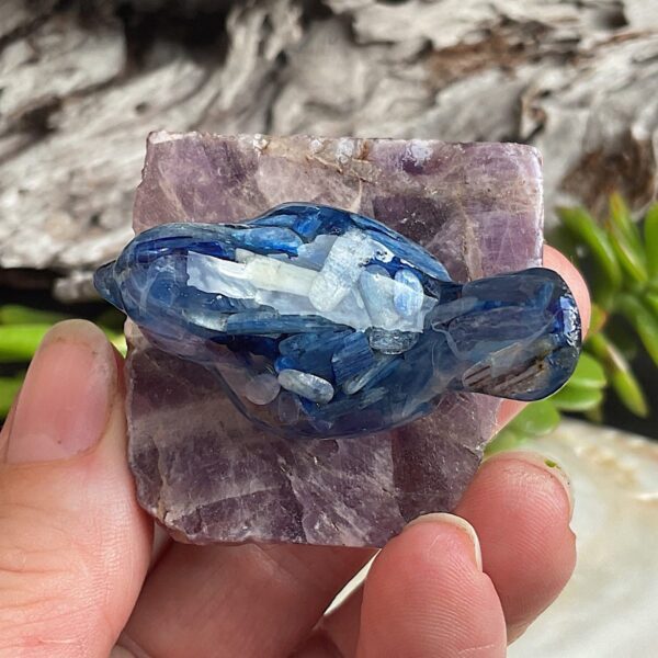 Blue kyanite bird made from resin on chevron amethyst base