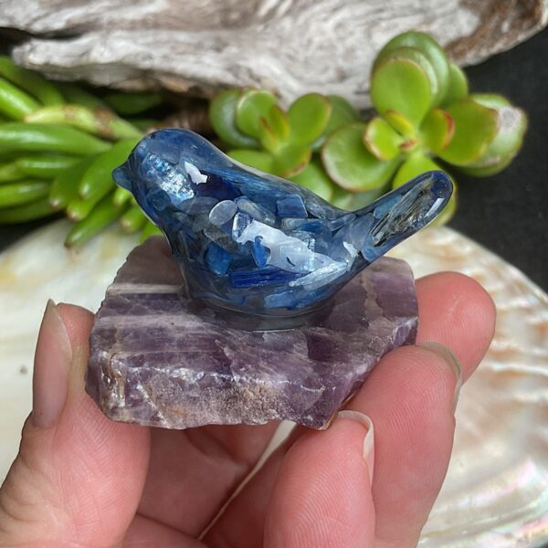 Blue kyanite bird made from resin on chevron amethyst base