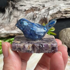 Blue kyanite bird made from resin on chevron amethyst