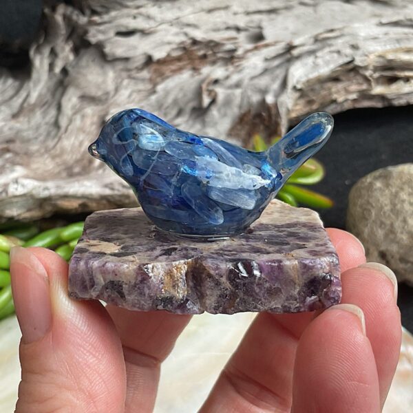 Blue kyanite bird made from resin on chevron amethyst