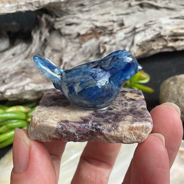 Blue kyanite bird made from resin on chevron amethyst