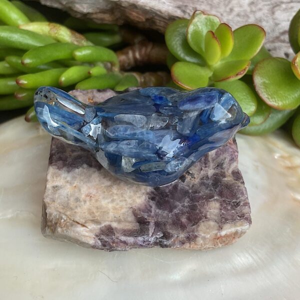 Blue kyanite bird made from resin on chevron amethyst