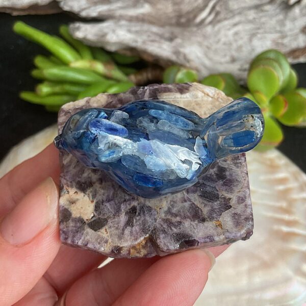 Blue kyanite bird made from resin on chevron amethyst